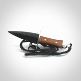 A striking hand carved knife pendant that we've called the blade. These are carved with a jade head and a hardwood handle. The cords are hand plaited in our waxed polyester which is robust, strong and durable. We ship these worldwide with express courier.